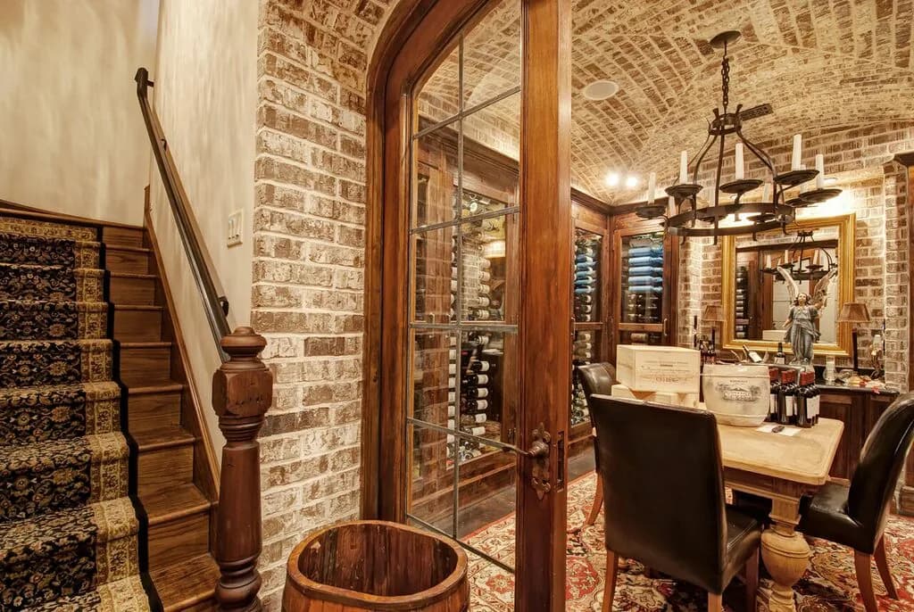 European-style brick wine cellar with bottle racking and cabinets.
