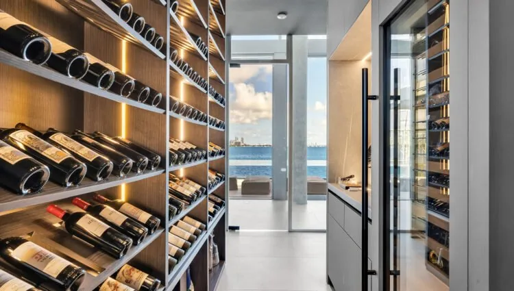 A contemporary glass wine cellar from a CellArtus Miami project.