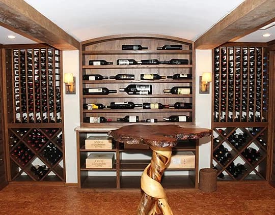 Traditional wood wine racks surround a sculptural tasting table.