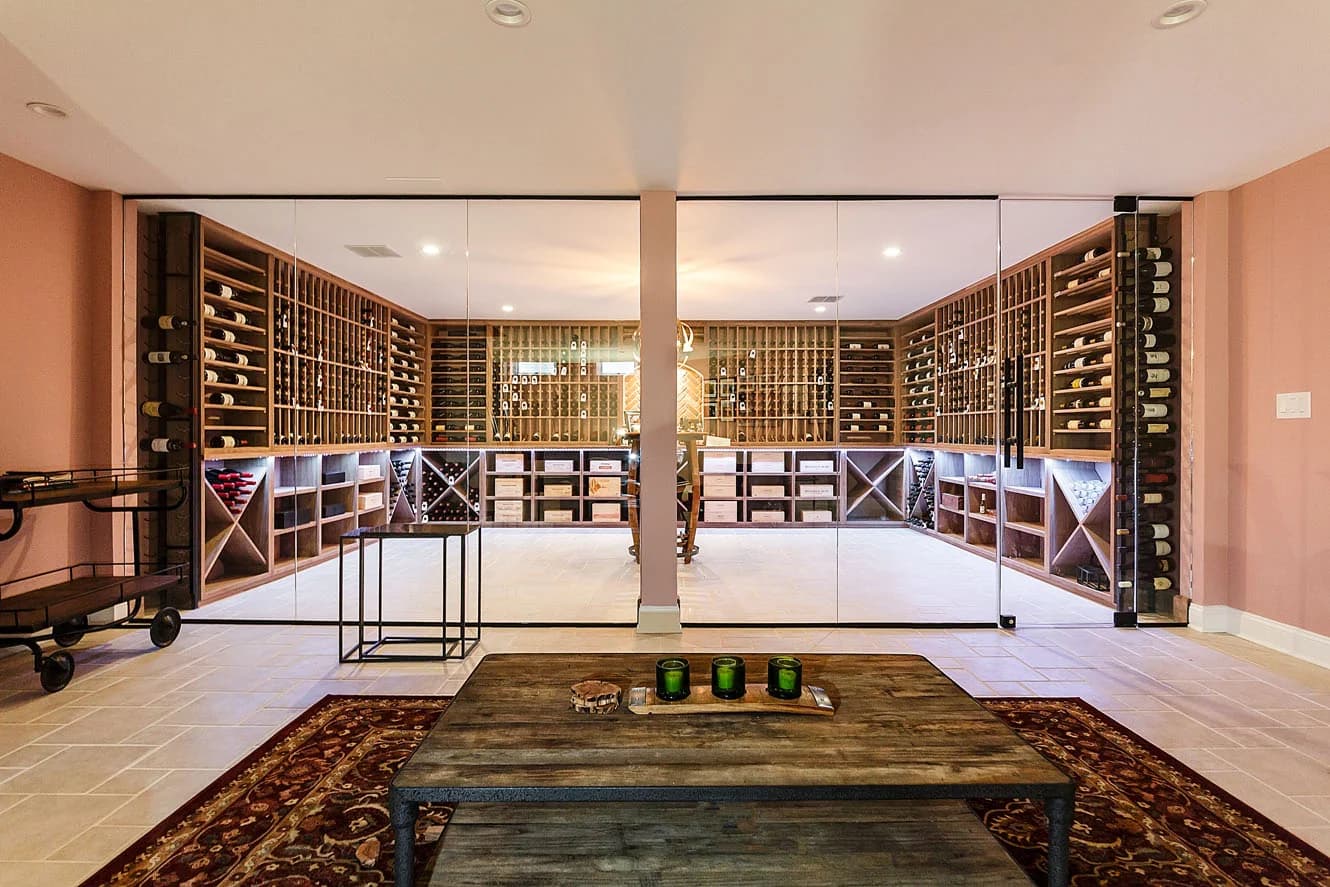 A glass-front wine room opens onto a furnished tasting lounge.