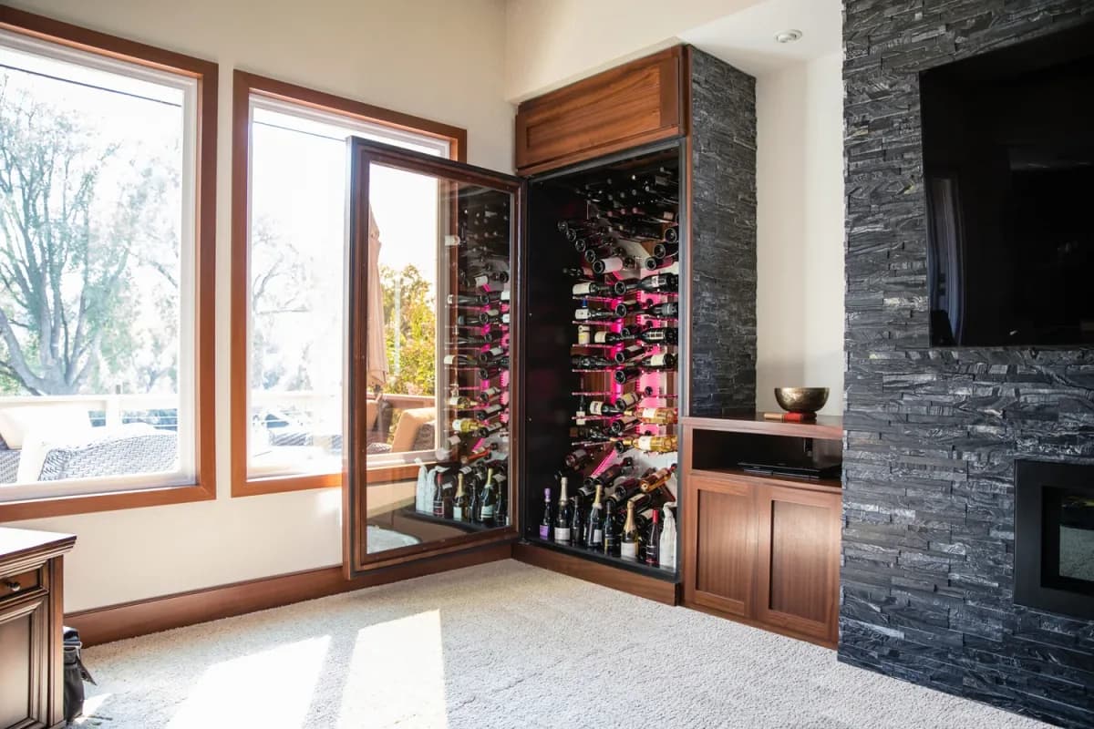 Wood racking and cabinetry frame a custom wine display.